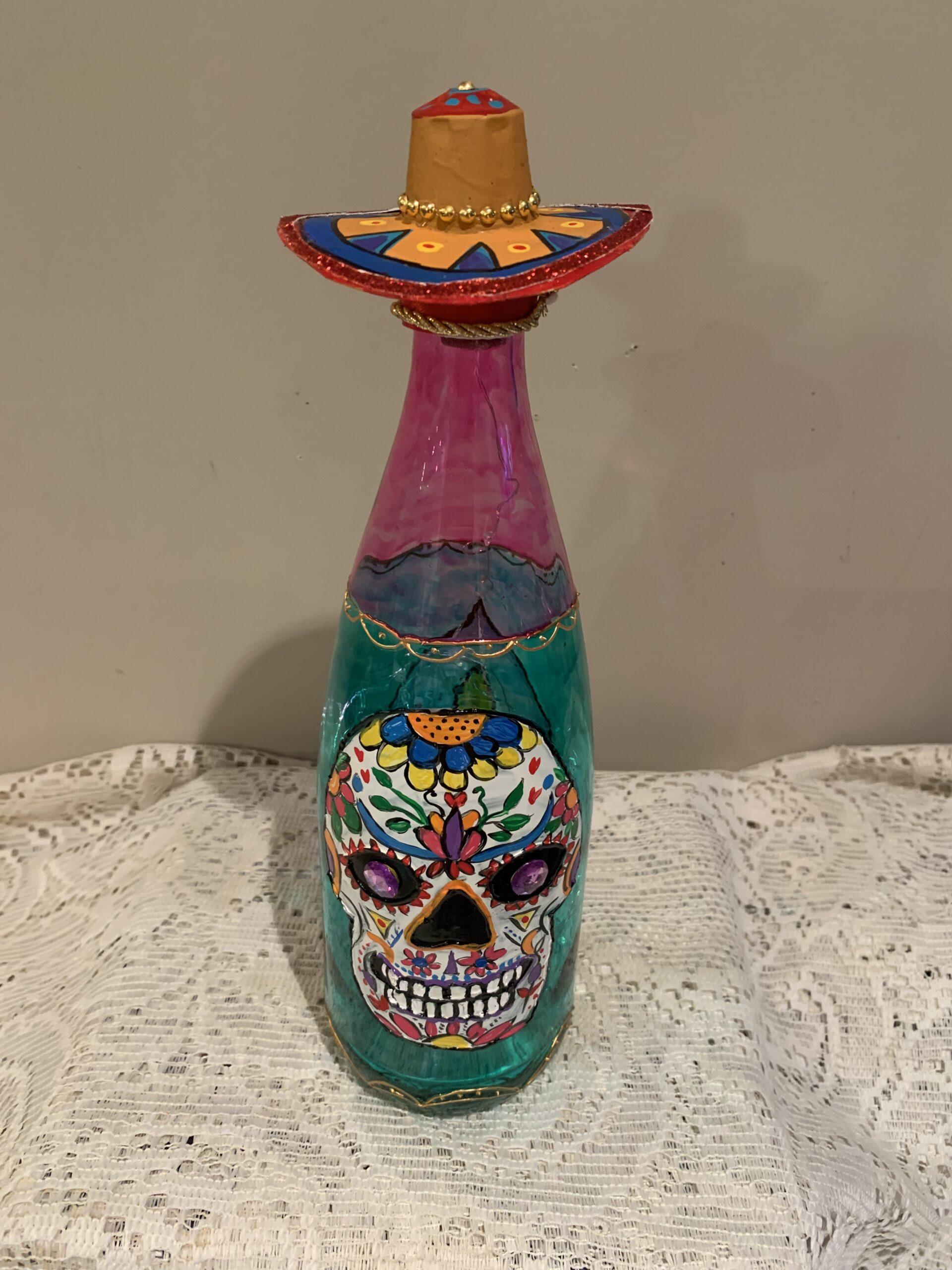 11” colourful, lighted Mexican skull bottle.
