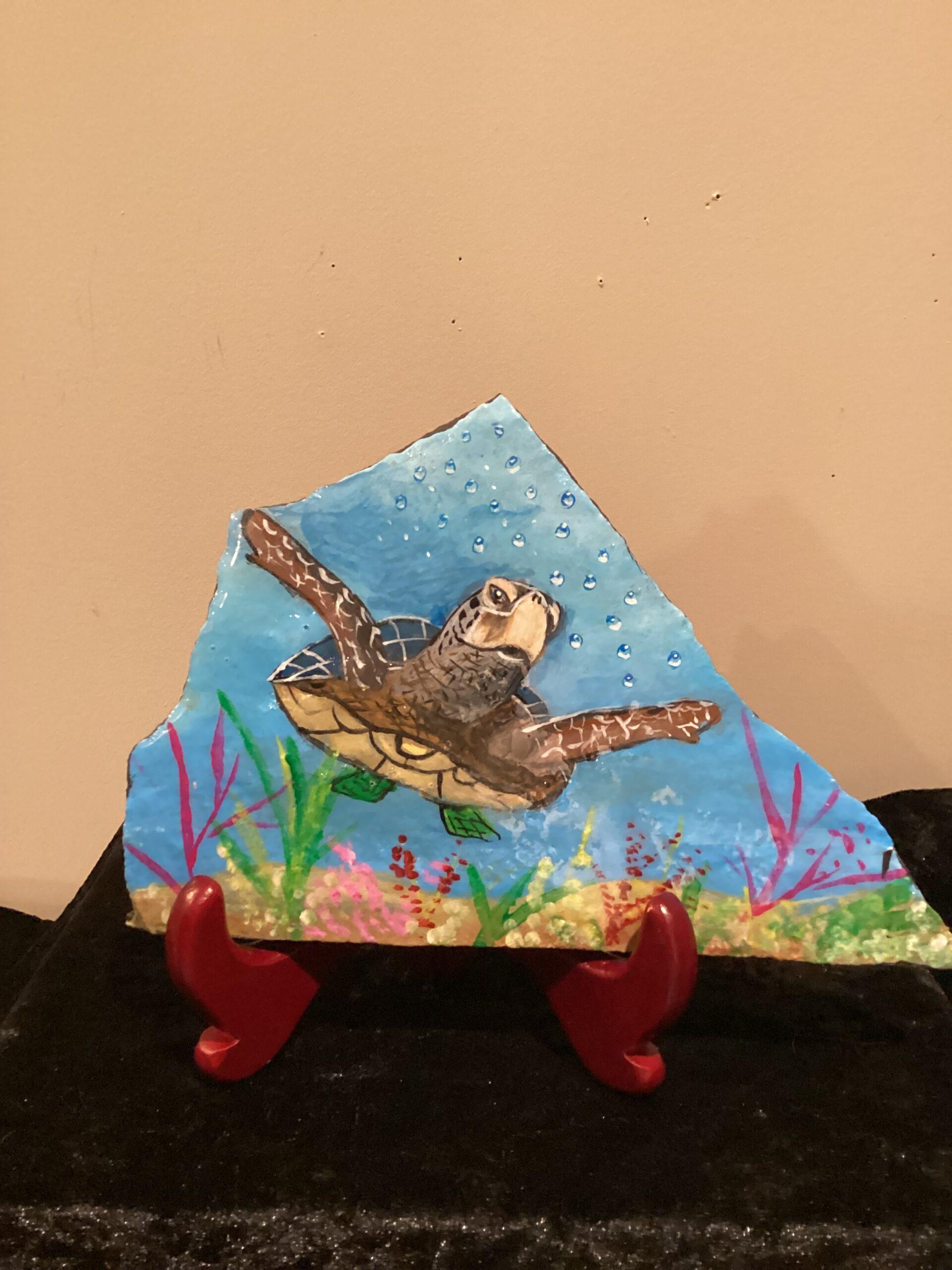 Hand painting on flat rock