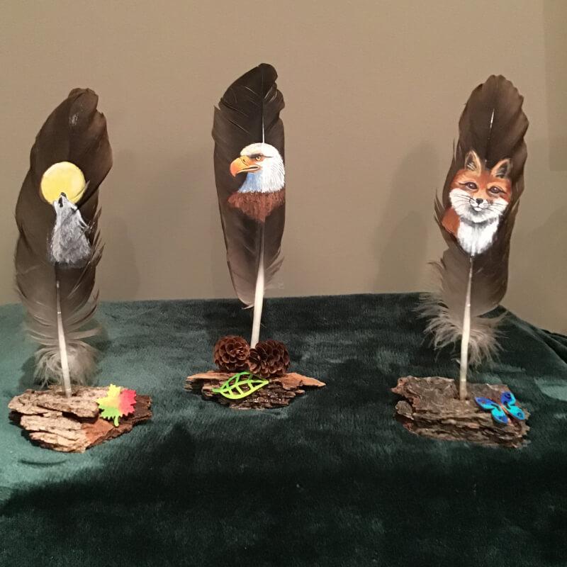 Hand-painted feathers on natural bark or white birch base